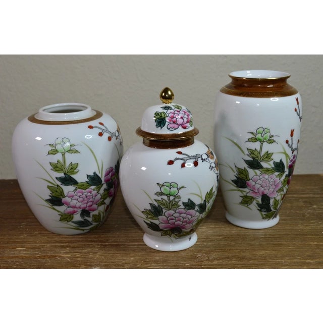Elegant three-piece Kutani-style porcelain ginger jar vase set, beautifully decorated with traditional Japanese birds and...