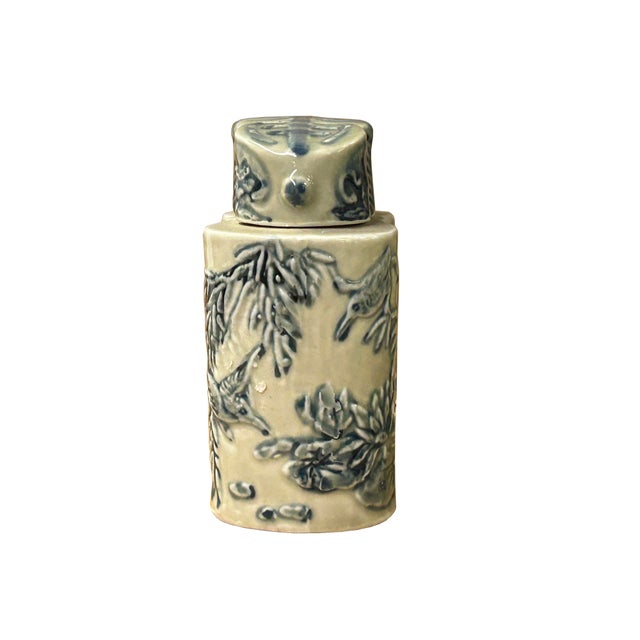 This exquisite Chinese blue and white porcelain tea caddy features a unique double-cylindrical or "twin" form, accented by...