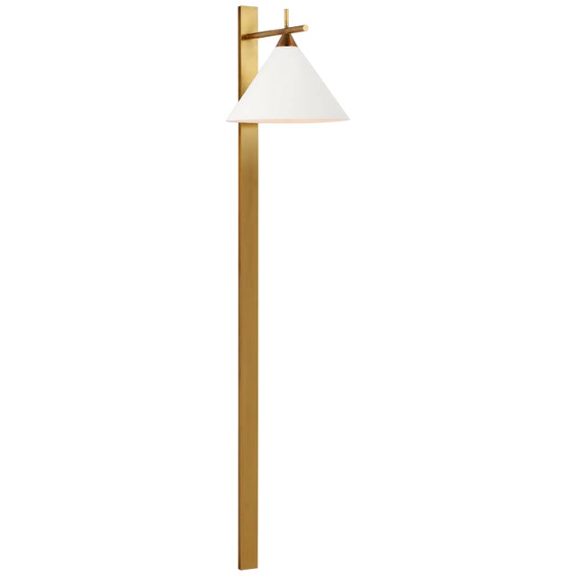 Cleo 56" Statement Sconce in Antique-Burnished Brass with Matte White Shade Designer: Kelly Wearstler Height: 56.25"...