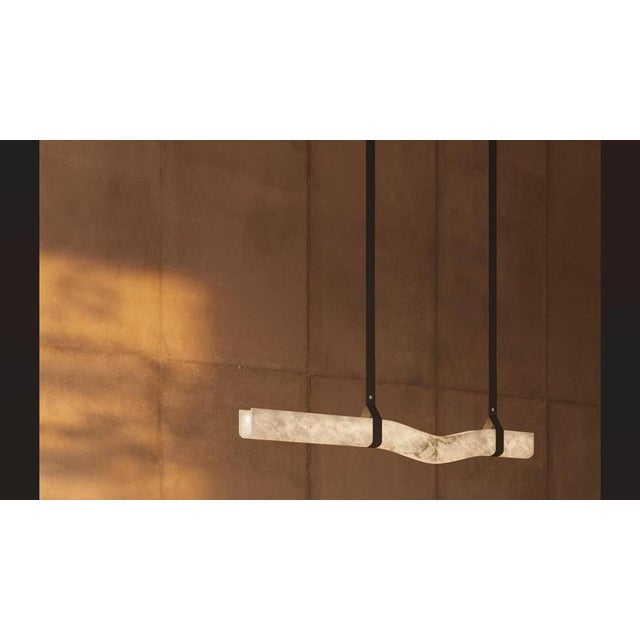 Signe pendant lamp by united alabaster dimensions: d 11 x w 185 x h 21 cm materials: alabaster, copper (matt black finish)...