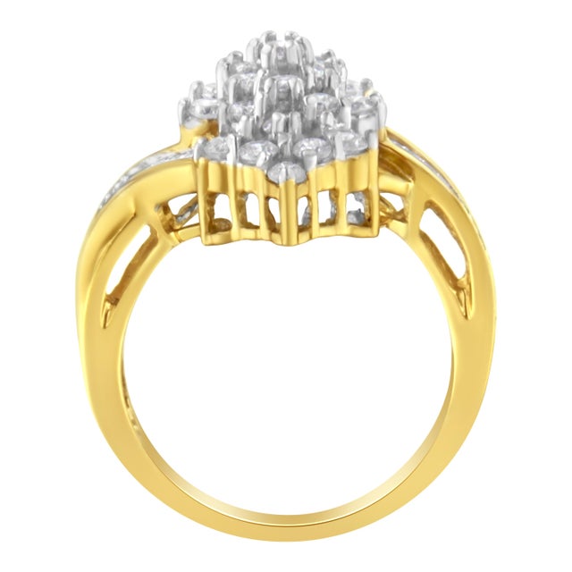 On top of a 10k yellow gold ring, sits a unique and eye catching 1 1/20ct round and baguette cut diamond cluster. The...