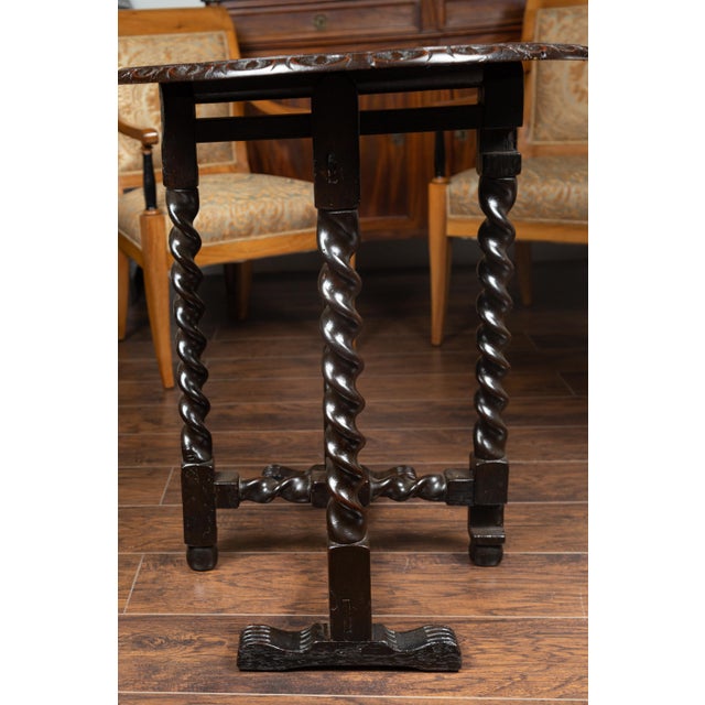 English 1850s Oak Gate Leg Oval Table with Carved Decor and Barley Twist Base For Sale - Image 4 of 12