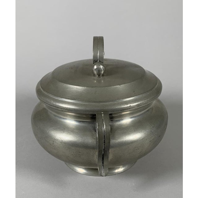 Tureen signed Jean Despres (1889-1980), Art Deco/Modernist style Decorated with fluted scroll handles The lid handle is...