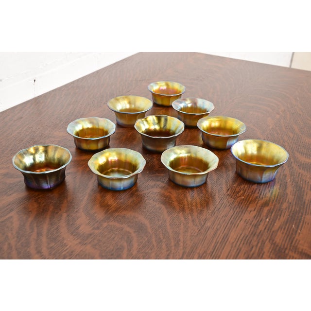 A gorgeous set of ten antique Arts & Crafts or Art Nouveau period Favrile iridescent art glass finger bowls or salt...