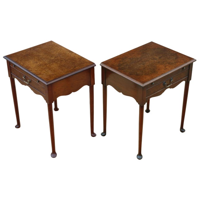 A fine-quality pair of mid-20th-century burr walnut bedside tables, which showcase attractive age, colour, and patina....