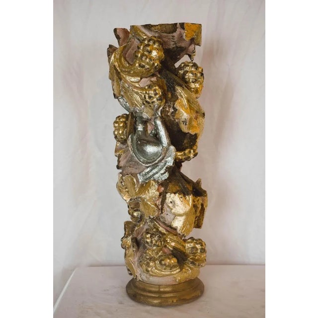 This gold gilt Portuguese architectural element has some hints of a pink patina as well. We have it hanging in our...