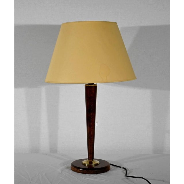 Mahogany lamp according to the famous Mazda products manufactured in the 1930s by the eponymous Franco-American company....