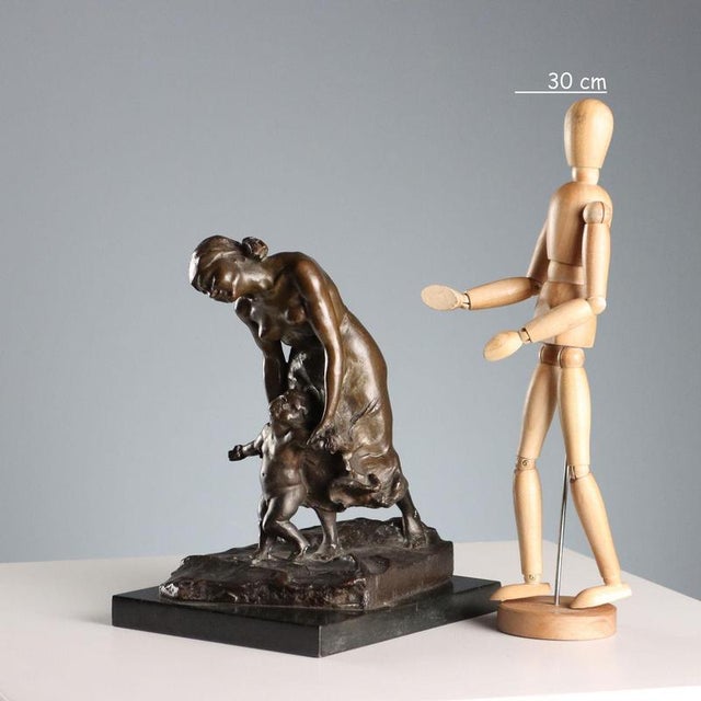 Bronze sculpture depicting a mother with a child taking his first steps. Artist: Anonymous. This piece is attributed to...