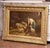 This impressive oil on canvas, painted in France circa 1870, captures a lively farmyard scene where an elderly woman tends...
