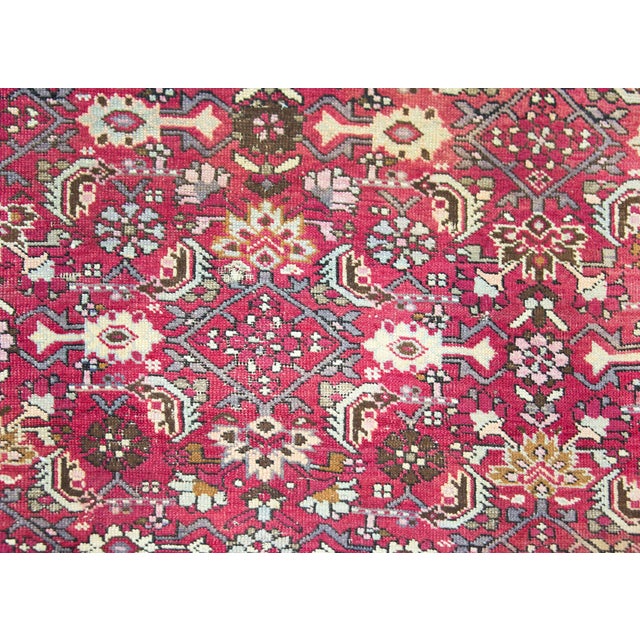A fantastic early 20th century Caucasian Karabagh rug with an all-over trellis stylized leaf and flower pattern woven in...