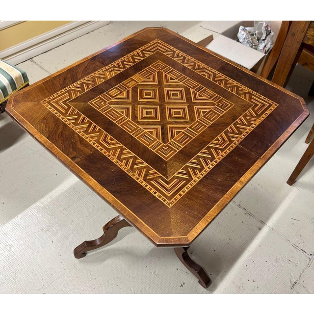 Late 19th century inlaid table. Height: 73 cm Length: 60X60 CM This piece is designed in the style of the selected...