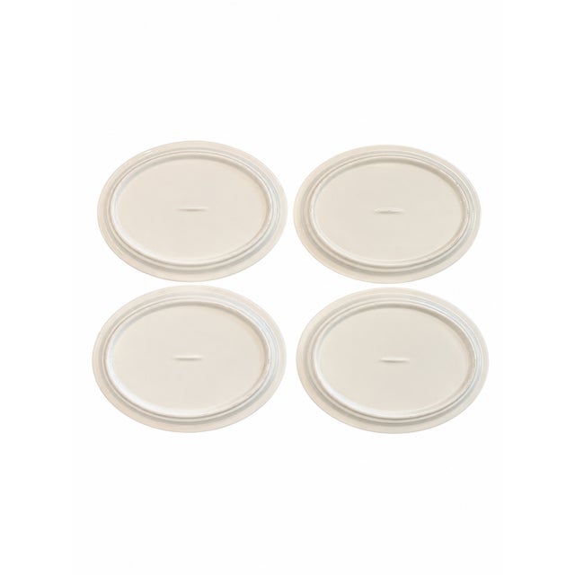 Charming set of four gold rimmed vintage ironstone oval petite serving platters featuring a classic ivory-white glazed...