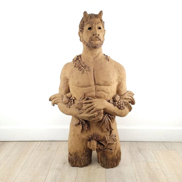A 3/4 life size statue of Pan (classical god of fertility and nature) by Burt Kessinick, Beat Generation potter active...