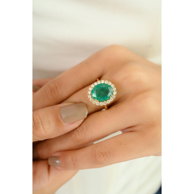 Make a bold and elegant statement with this exquisite ring masterfully crafted in 14kt yellow gold. At the heart of this...