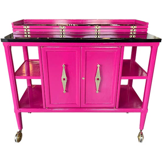 Playful yet refined, this vibrant pink cabinet makes an unforgettable statement. Featuring a classic bar cart silhouette...