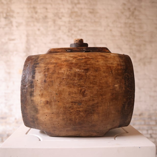 Add authentic rustic character to your space with this 19th century French wooden wine barrel, a beautifully aged piece...