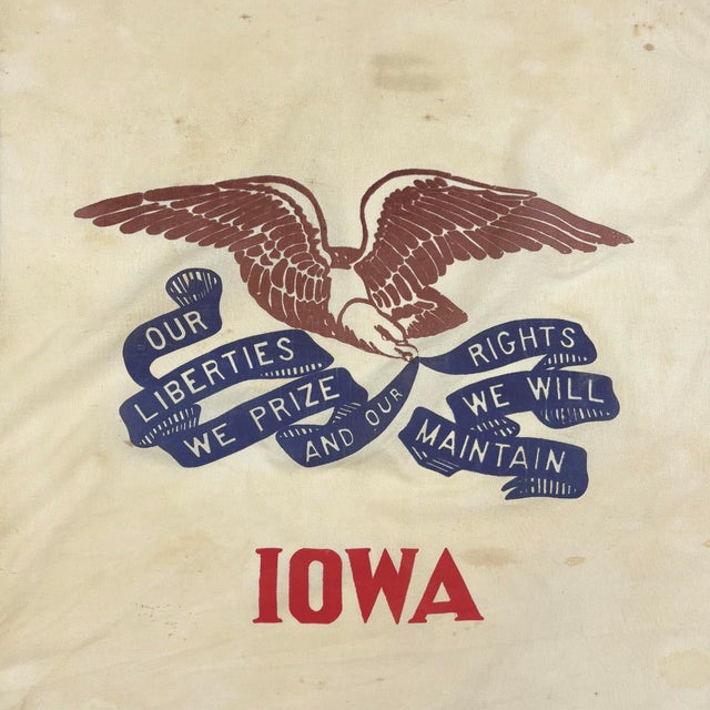 This vintage Iowa state flag is made from a cotton cloth with sewn panels, and printed emblem visible on both sides....