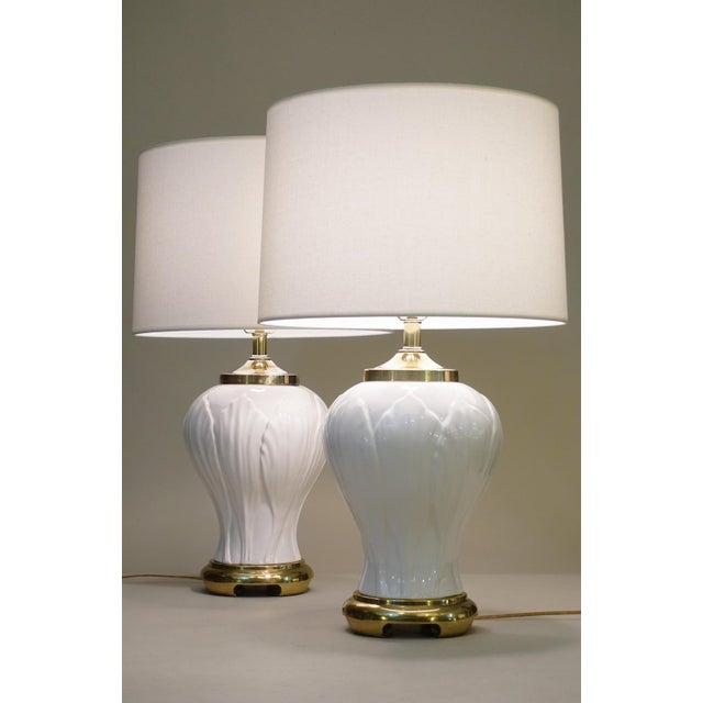 An impressive and visually stunning pair of large Hollywood Regency Modern sculptural Ginger Jar form Tulip relief...