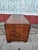 Leather-covered storage trunk with a brown finish. This chest has decorative brass nailhead trim along the edges and a...