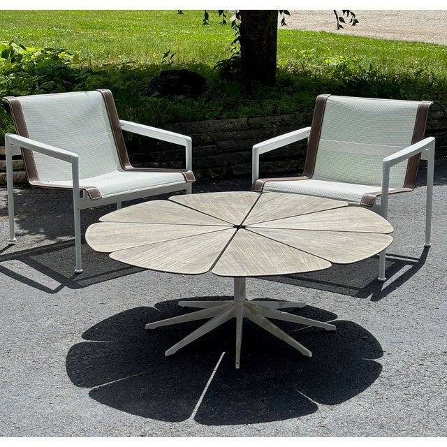 This authentic Richard Schultz Petal® Coffee Table has a teak top and power steel stem and powder-coated cast-aluminum...