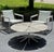 This authentic Richard Schultz Petal® Coffee Table has a teak top and power steel stem and powder-coated cast-aluminum...