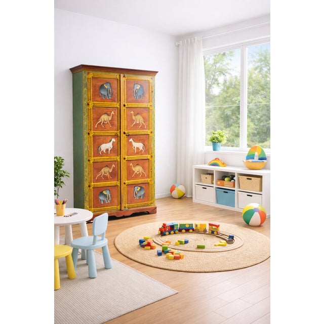 This striking armoire is a true statement piece, handcrafted and richly decorated with traditional folk-art detailing....