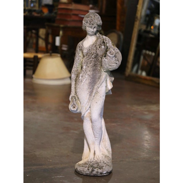Decorate a garden or patio with this elegant antique outdoor statue. made of cast stone in France circa 1920, the figure...