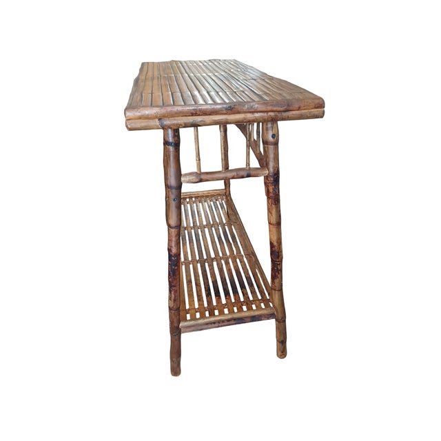 Vintage Late 20th century boho chic tortoiseshell bamboo console table. Table has spindle details with a lower shelf.