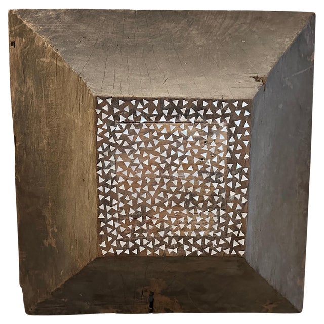 Originally a wood base for a column. We added by hand, shell inlaid into the flat surface. An interesting art object to...