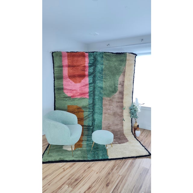 A painterly Beni Mrirt in cream, taupe, emerald, sage, coral and rust — soft-edged color blocks arranged like an abstract...