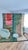 A painterly Beni Mrirt in cream, taupe, emerald, sage, coral and rust — soft-edged color blocks arranged like an abstract...