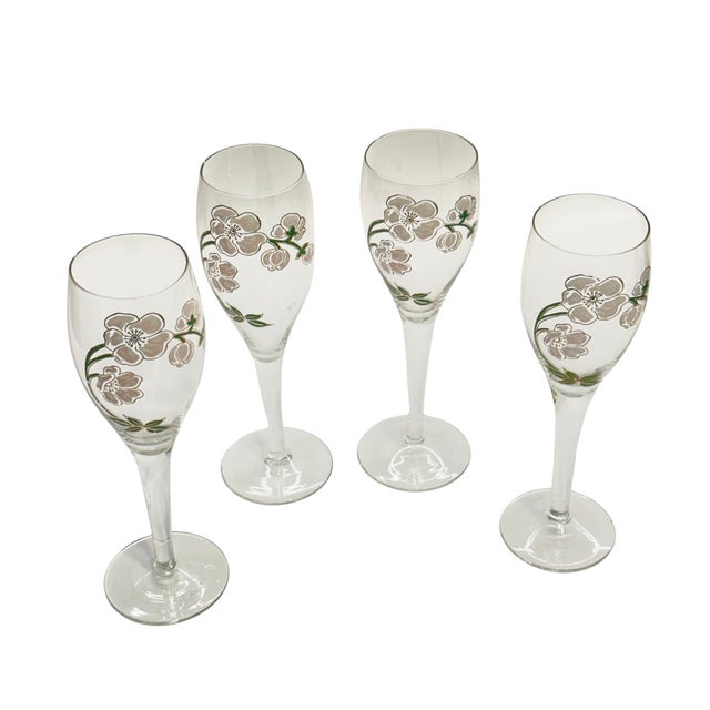 Elegant set of four vintage Perrier-Jouët Belle Epoque champagne flutes, decorated with the house's iconic white Japanese...