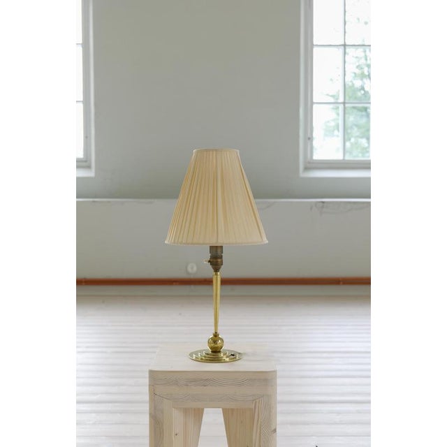 Genuinely nice Art Deco Swedish table lamp made in brass during the 1930s. This lamp made with a base of brass and a...