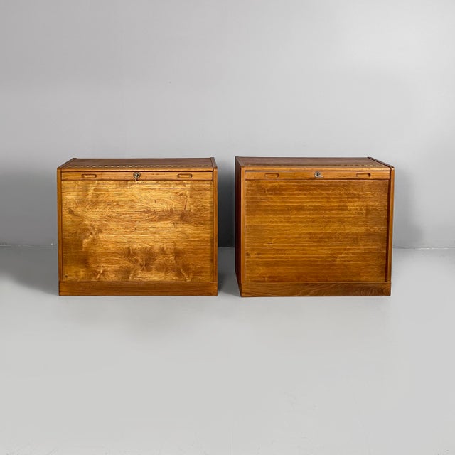German mid-century modern archive cabinets in wood with shutter opening, 1940s Pair of rectangular wooden office filing...