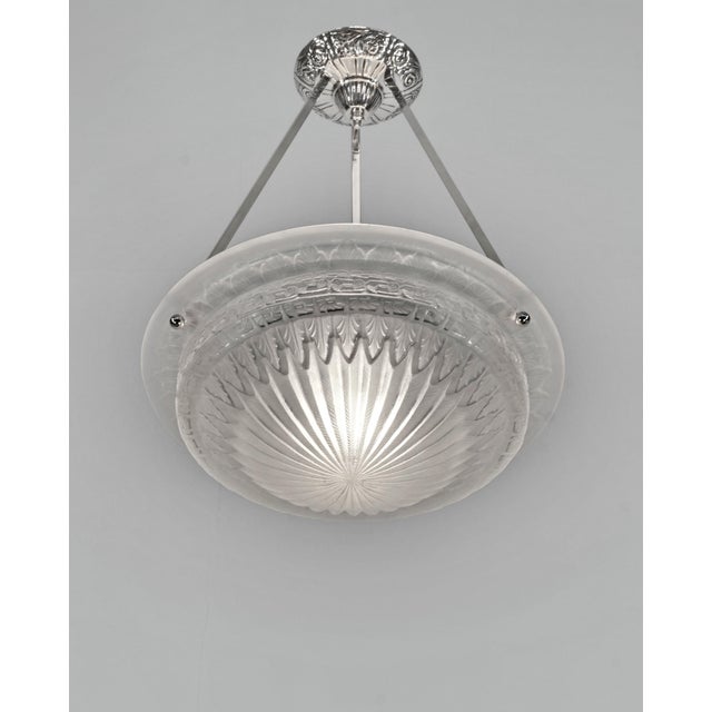 Charles Schneider A nice French art deco pendant made around 1925-1935 in nickel plated bronze or solid brass. It holds a...