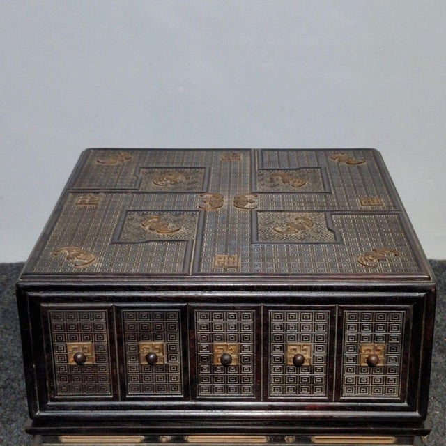 An exquisite and highly intricate antique Chinese hardwood tabletop chest or jewelry box. Crafted with exceptional...