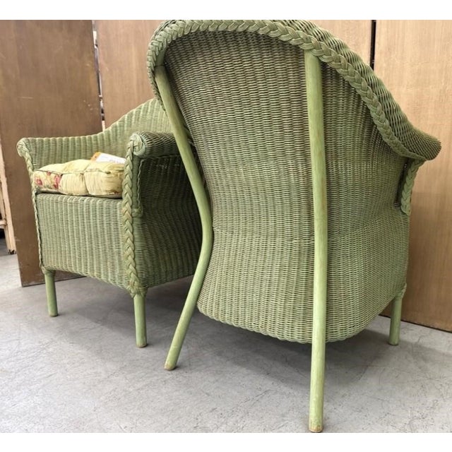 A beautifully crafted pair of vintage wicker tub armchairs featuring an elegant hand-painted sage green finish with the...