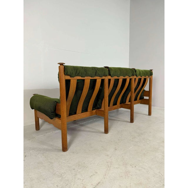 Vintage brutalist 3 seater sofa/bench in oak and green Ribbled original fabric. Very solid sofa. 2 matching one seater,...