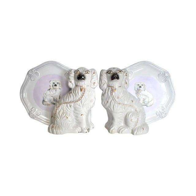 An antique, c. 1860s pair of Victorian English Staffordshire spaniel dogs, white with gold gilt details, 7.25"x4.5"x9.5"....