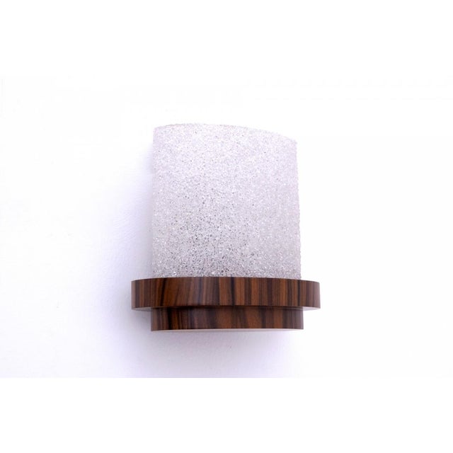 Art Deco wall lamp, Poland, 1960s. Base made of wood, veneered with walnut wood. Shade made of textured glass. Dimensions:...