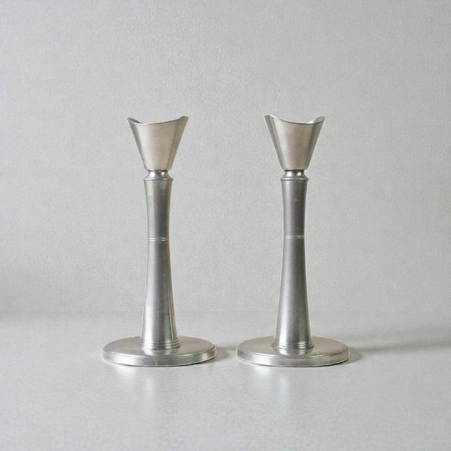 Elegant pair of swedish pewter candlesticks produced by gab (guldsmedsaktiebolaget) in the 1940s. The design features a...