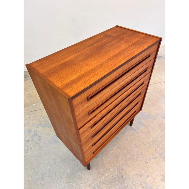 This Danish chest of drawers from the mid-century era is an exquisite example of the pinnacle of Scandinavian furniture...