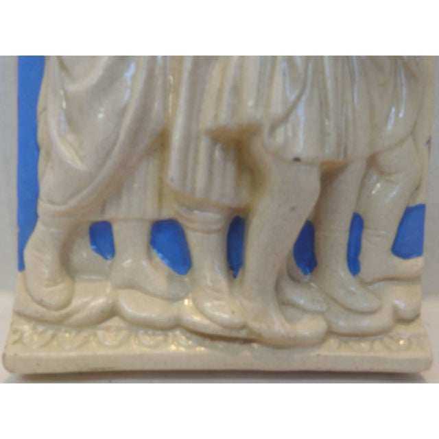 This listing features a high relief Della Robbia polychrome glazed pottery plaque that was made in Italy. It has a group...