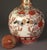 A hand-painted antique Japanese Kutani porcelain bottle vase with its original stopper, made in the late Meiji period,...