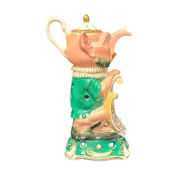 Very rare Russian Porcelain Veilleuse-Theiere Night Light. This night light is modeled in the Grotesque form of a seated...
