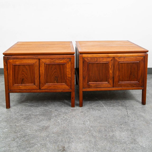 Pair of high-quality walnut end tables. Doors easily push to open. Unmarked examples.