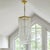 Long mid-century Lucite ribbon chandelier with brass finish.
