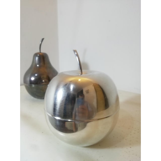 Timeless pair of original vintage apple and pear objects. Designed by Lino Sabattini for Fleuron Christofle. Both marked...