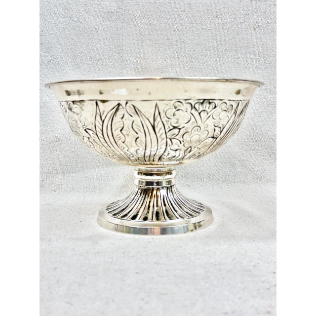 Beautiful vintage silver colored compote. Intricate design that features flowers and leaves. Perfect to use with fruit,...