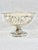 Beautiful vintage silver colored compote. Intricate design that features flowers and leaves. Perfect to use with fruit,...